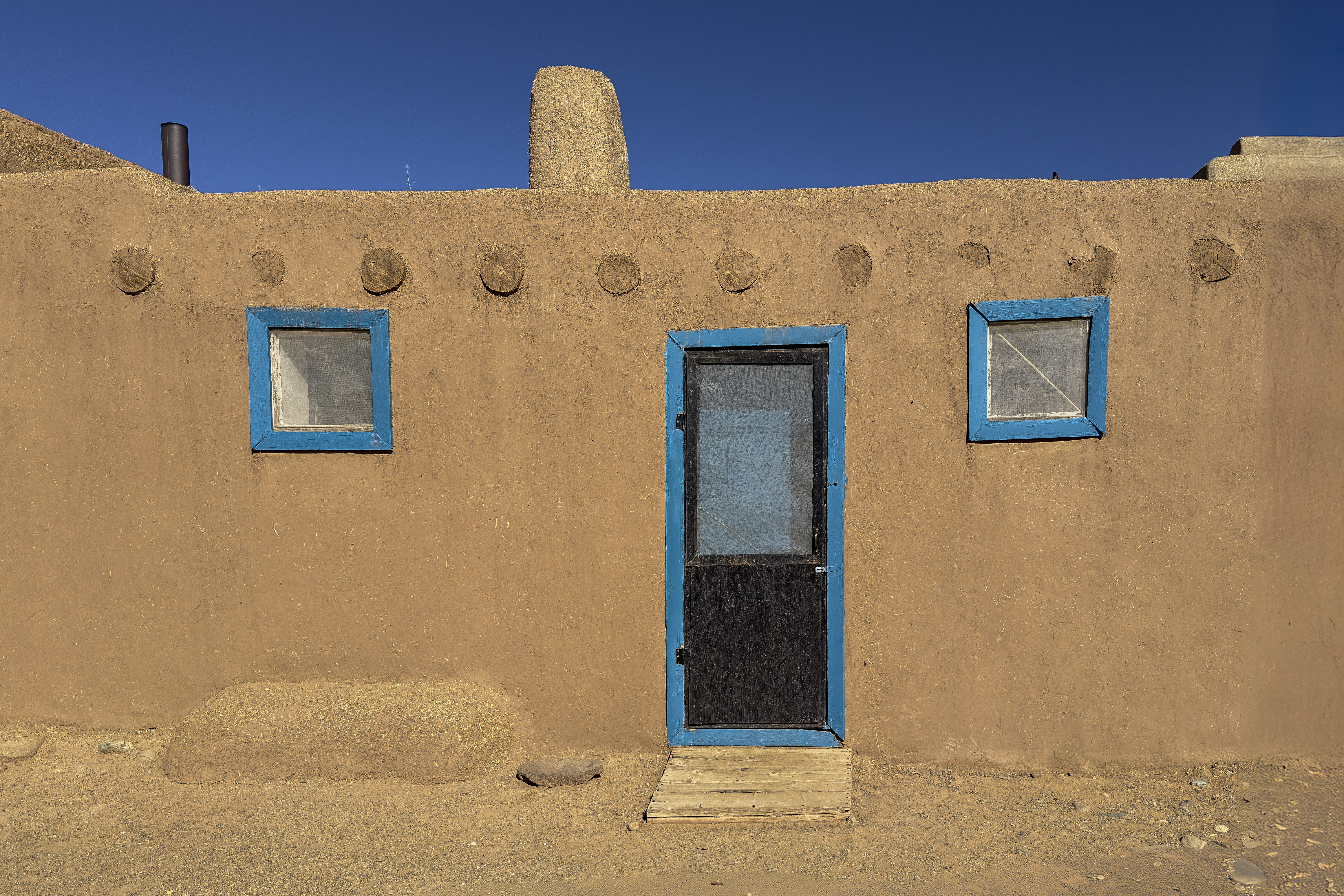 Blue Adobe House by Tom Heywood Photography
